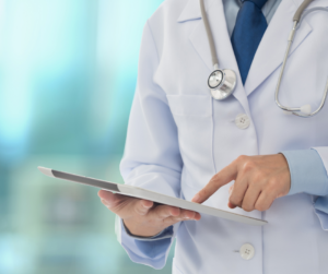 A doctor looking at a chart