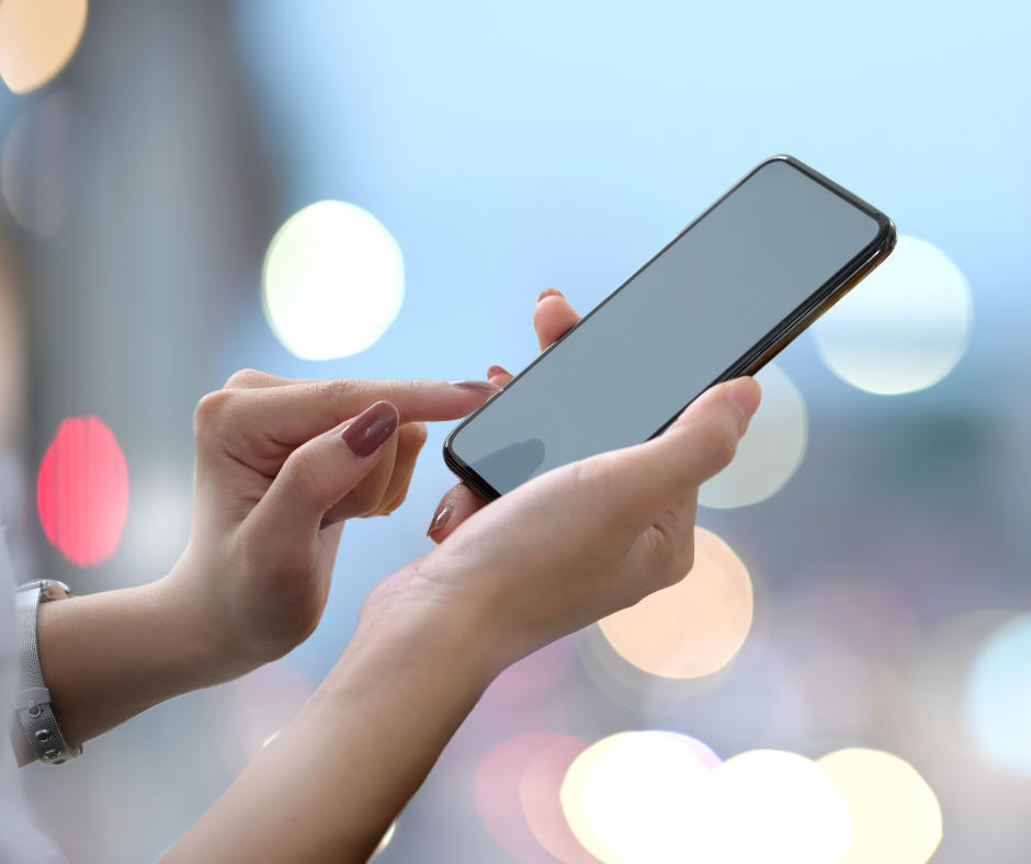 Woman texting on cell phone