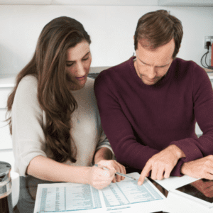 A couple with a credit union membership discussing their financial health. 