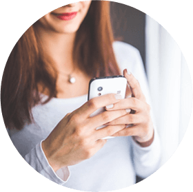 Lady looking at white cell phone